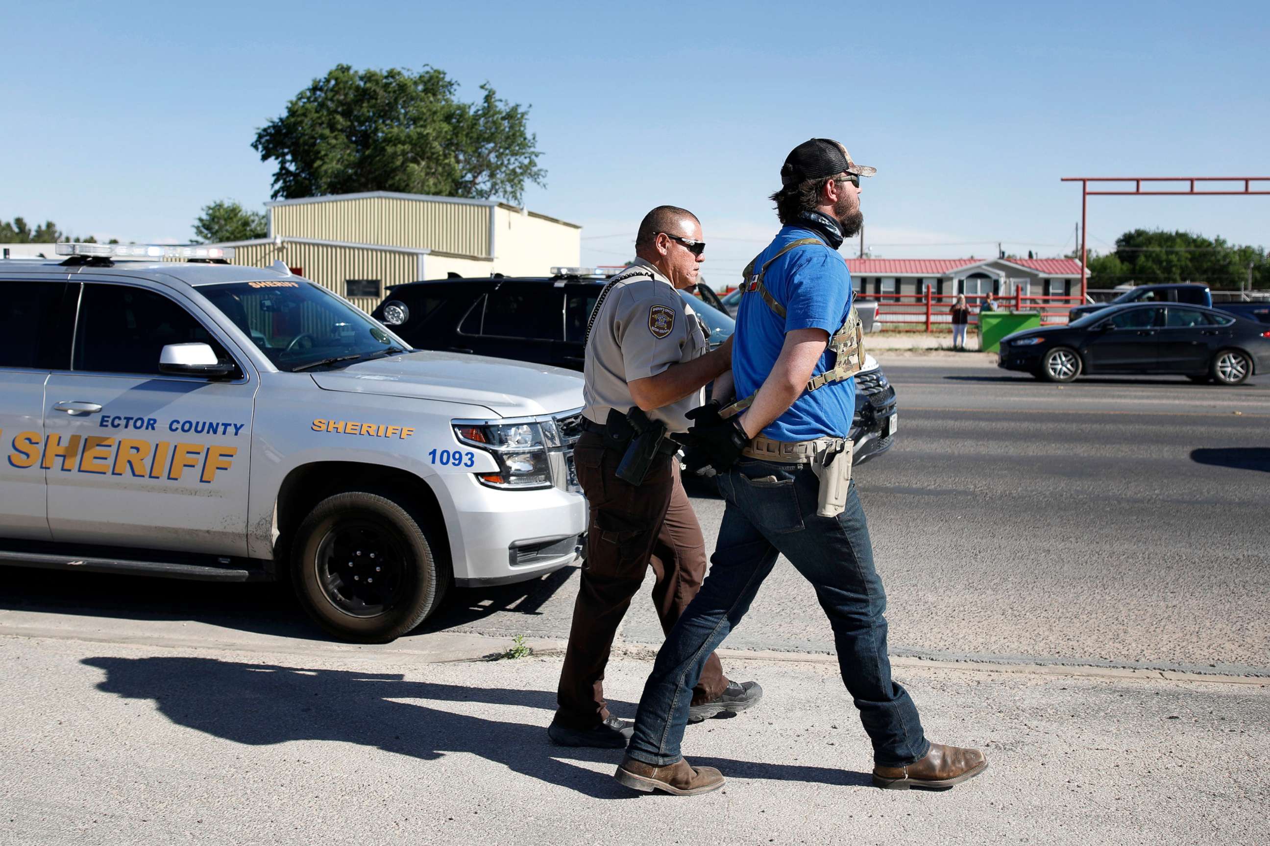 PHOTO: Wyatt Winn is led away in handcuffs outside Big Daddy Zane's bar, May 4, 2020, near Odessa, Texas.