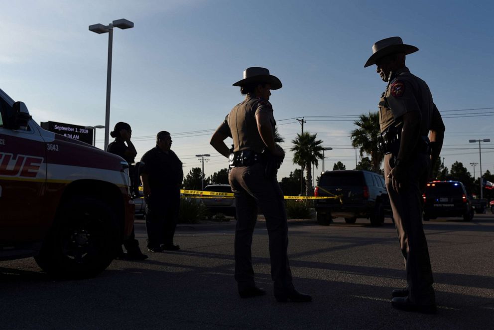 PHOTO: Texas state troopers and other emergency personnel monitor the scene at a local car dealership following a shooting in Odessa, Texas, Sept. 1, 2019. 