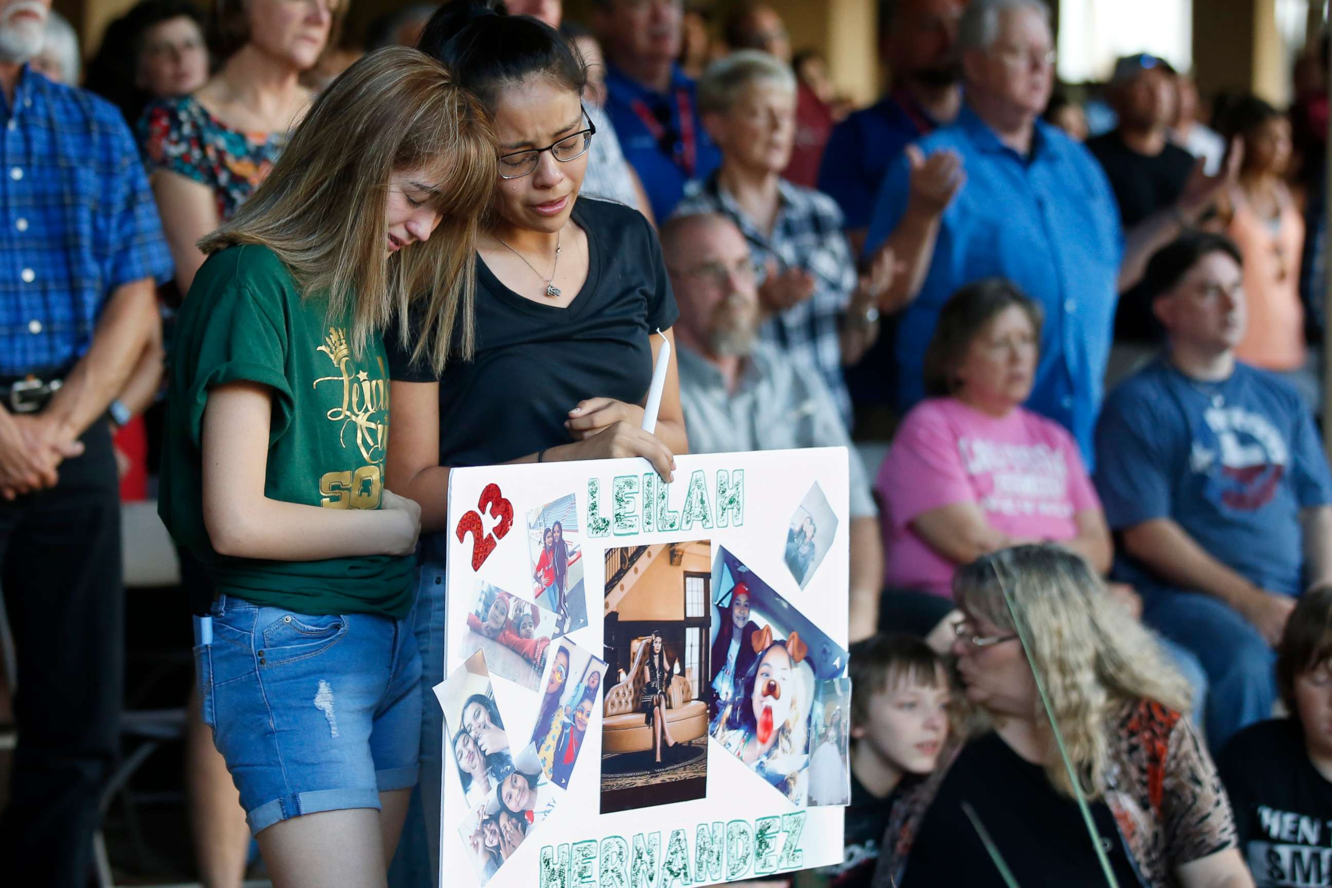 PHOTO: High School students Celeste Lujan, left, and Yasmin Natera, right, mourn their friend, Leila Hernandez, one of the victims of the Saturday shooting in Odessa, at a memorial service Sunday, Sept. 1, 2019, in Odessa, Texas.