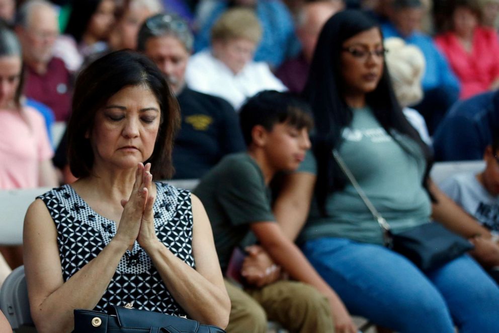 PHOTO: Mira Marquez, of Midland, Texas, folds her hands in prayer during a prayer service, Sunday, Sept. 1, 2019, in Odessa, Texas, for the victims of a shooting spree the day before.