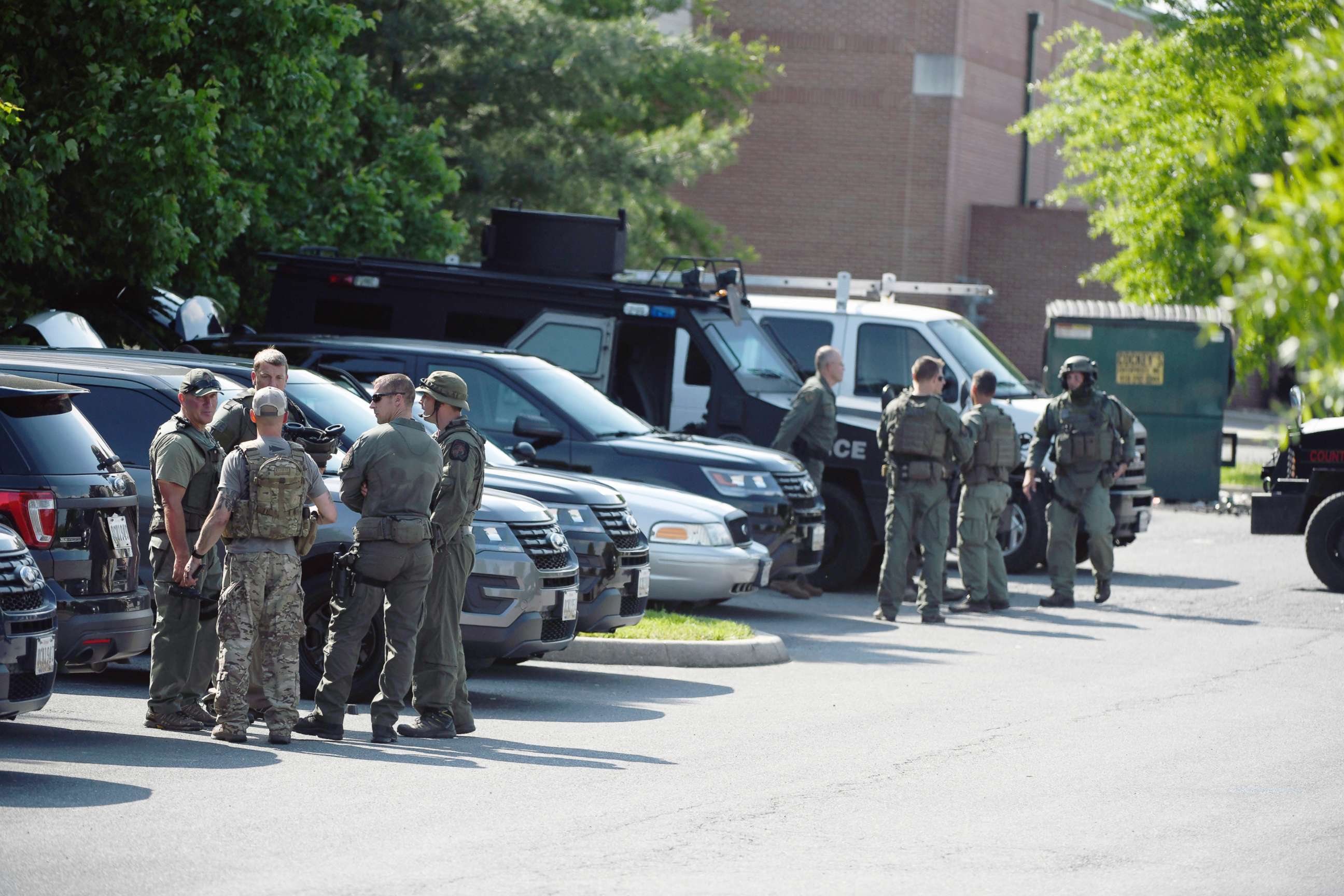 PHOTO: Tactical police stage in a Safeway parking lot on Belair Road near Chapel Road in response to the death of a Baltimore County police officer in Perry Hall, Md., May 21, 2018.