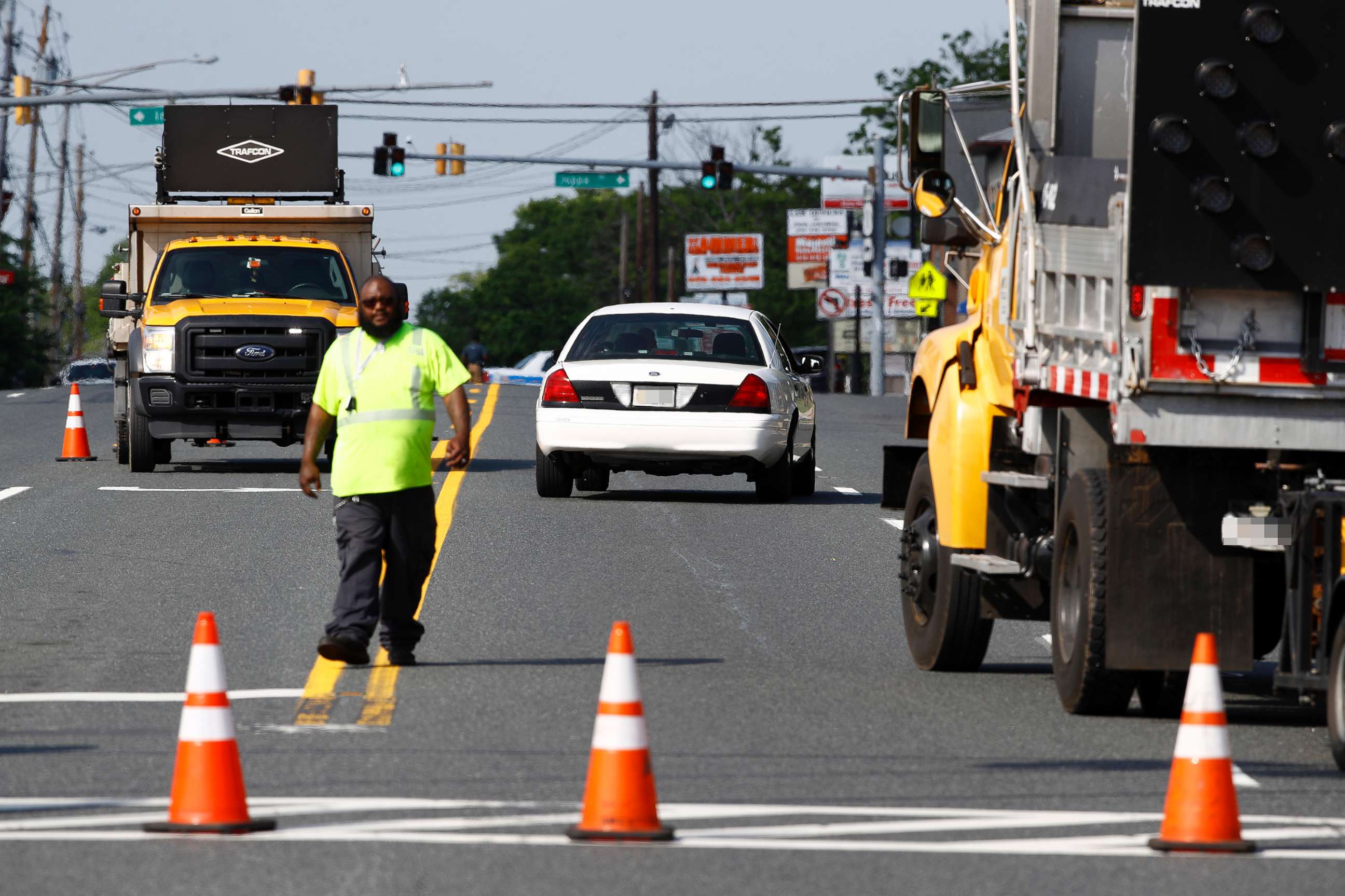 PHOTO: An emergency vehicle passes a roadblock near a scene, May 21, 2018, in Perry Hall, Md.