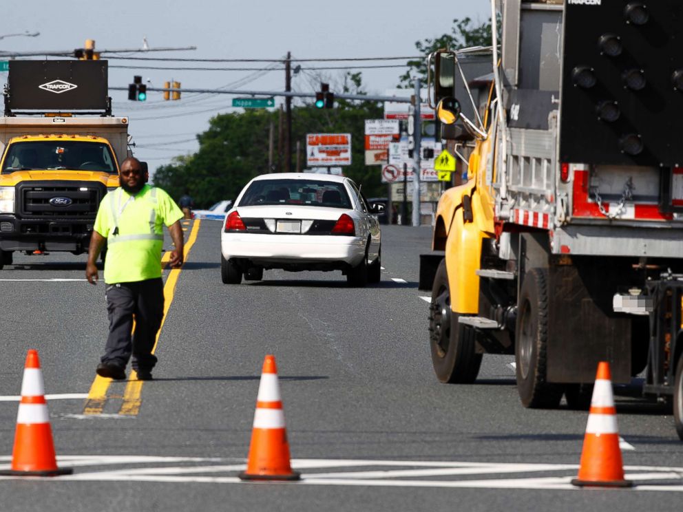 PHOTO: An emergency vehicle passes a roadblock near a scene, May 21, 2018, in Perry Hall, Md.