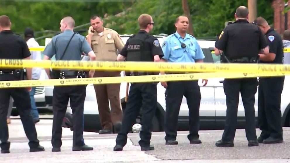 PHOTO: Law enforcement officers congregate at the scene in Wellston, Mo., where  North County Police Cooperative Police Officer Michael Langsdorf was shot and killed, June 24, 2019. 