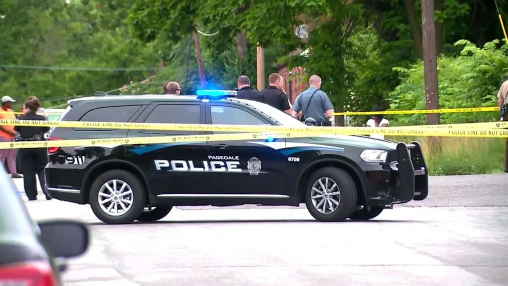 PHOTO: Law enforcement officers congregate at the scene in Wellston, Mo., where  North County Police Cooperative Police Officer Michael Langsdorf was shot and killed, June 24, 2019. 