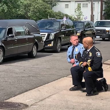 Minneapolis Police chief Medaria Arradondo and Sgt. Dave O'Connor knelt as George Floyd's hearse arrived at his memorial.