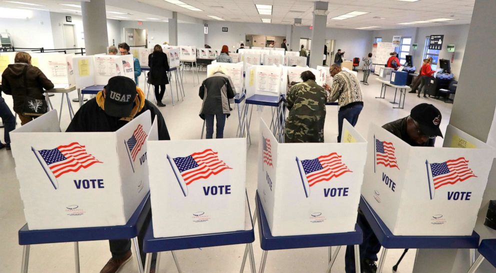 PHOTO: People participate in early voting, Friday, March 13, 2020, in Cleveland.