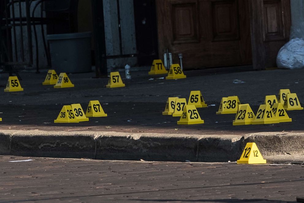 PHOTO: Police mark evidence after an active shooter opened fire in the Oregon district in Dayton, Ohio, Aug. 4, 2019. 