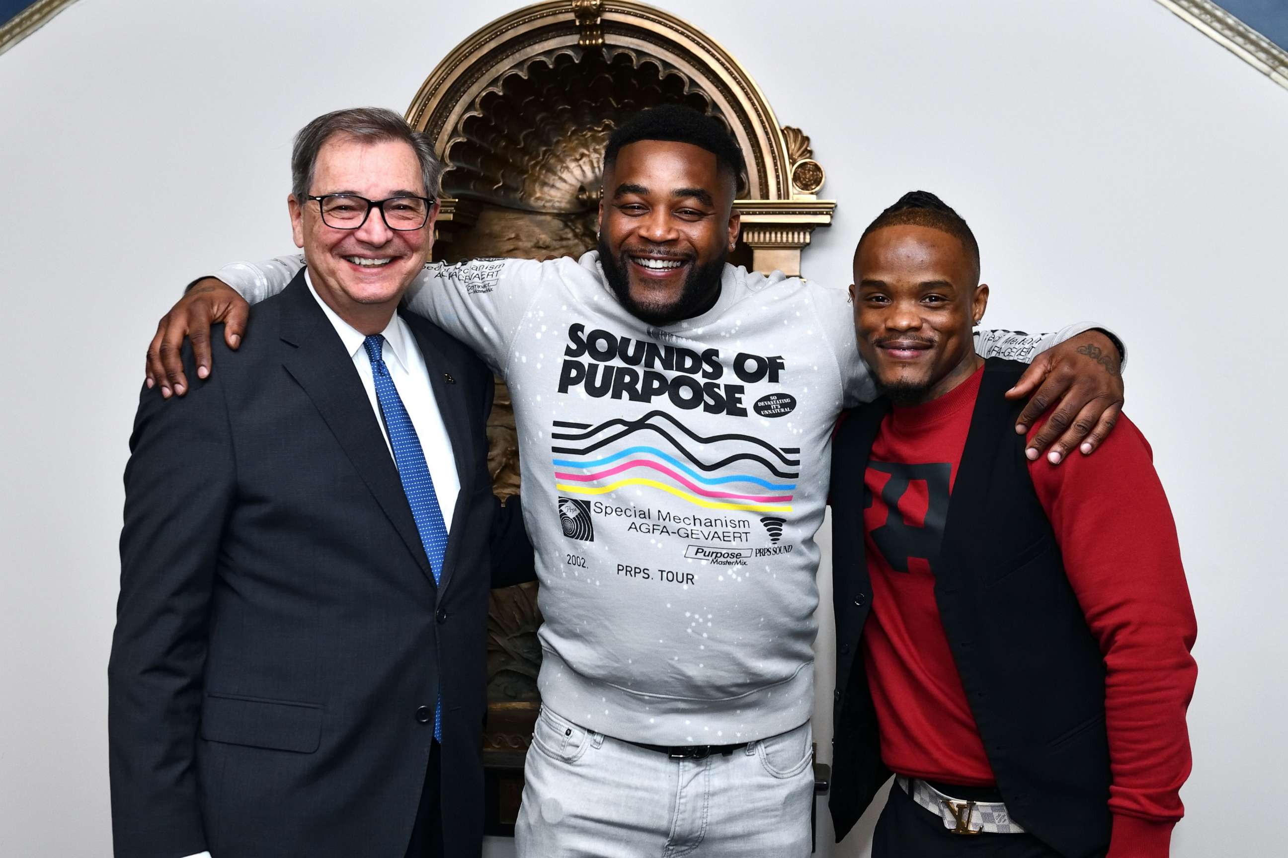 PHOTO: University of Akron President Gary L. Miller (left) awarded Michael Sutton (middle) and Kenny Phillips full scholarships after they were released from a wrongful conviction.