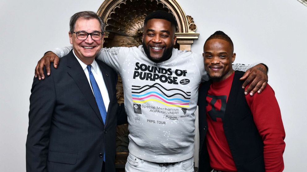 PHOTO: University of Akron President Gary L. Miller (left) awarded Michael Sutton (middle) and Kenny Phillips full scholarships after they were released from a wrongful conviction.