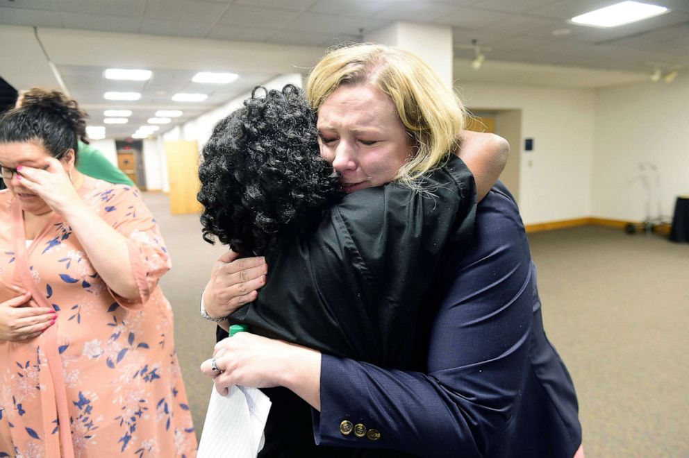 PHOTO: Dayton Mayor Nan Whaley (R) is consoled by a member of the religious community moments after her press conference on a shooting in the Oregon District of Dayton, Ohio, Aug. 4, 2019. 