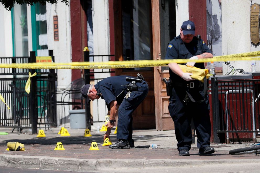 PHOTO: Authorities retrieve evidence markers at the scene of a mass shooting, Aug. 4, 2019, in Dayton, Ohio.