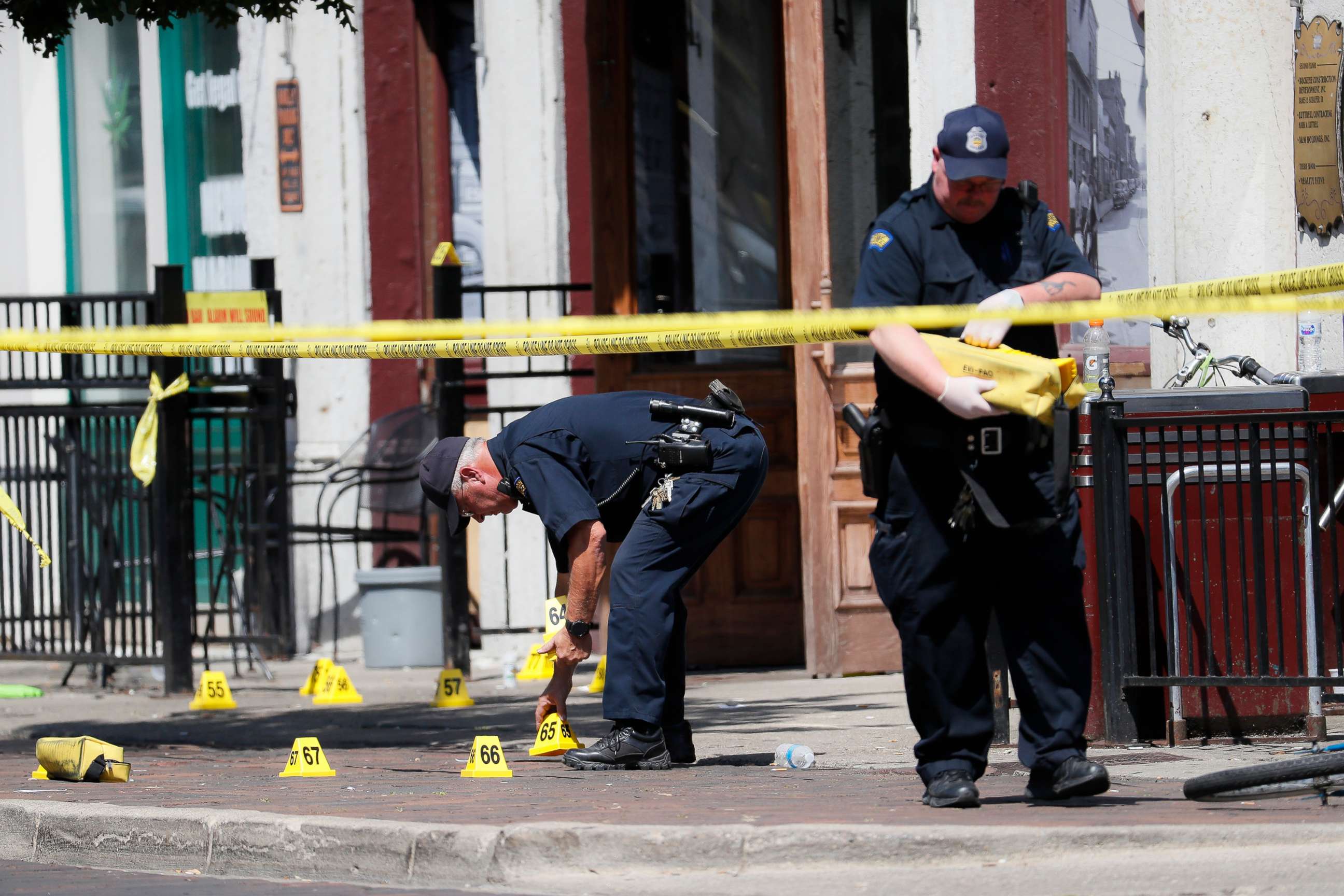 PHOTO: Authorities retrieve evidence markers at the scene of a mass shooting, Aug. 4, 2019, in Dayton, Ohio.