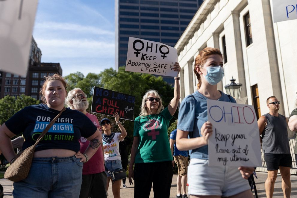 PHOTO: In this June 24, 2022, file photo, abortion rights protesters hold signs at a rally in Columbus, Ohio.