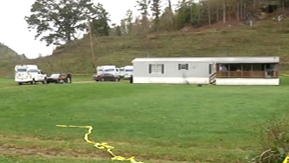PHOTO: Crime scene tape and police vehicles at the scene of a quadruple killing in Lawrence County, Ohio.