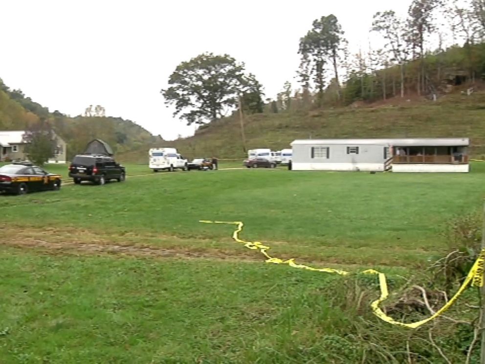 PHOTO: Crime scene tape and police vehicles at the scene of a quadruple killing in Lawrence County, Ohio.