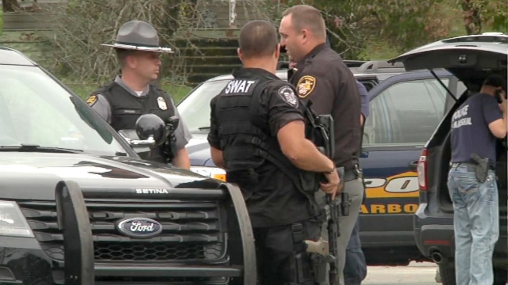 PHOTO: Police gather at the scene of a murder where four people were killed in Lawrence County, Ohio. 