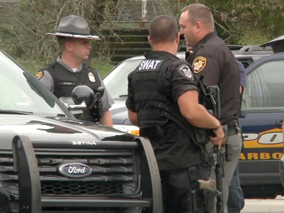 PHOTO: Police gather at the scene of a murder where four people were killed in Lawrence County, Ohio.
