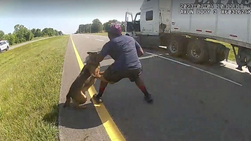 PHOTO: Police bodycam screengrab shows Jadarrius Rose being attacked by an Ohio K-9 dog on July 4, 2023, after attempting to surrender to police with his hands up following a highway chase.