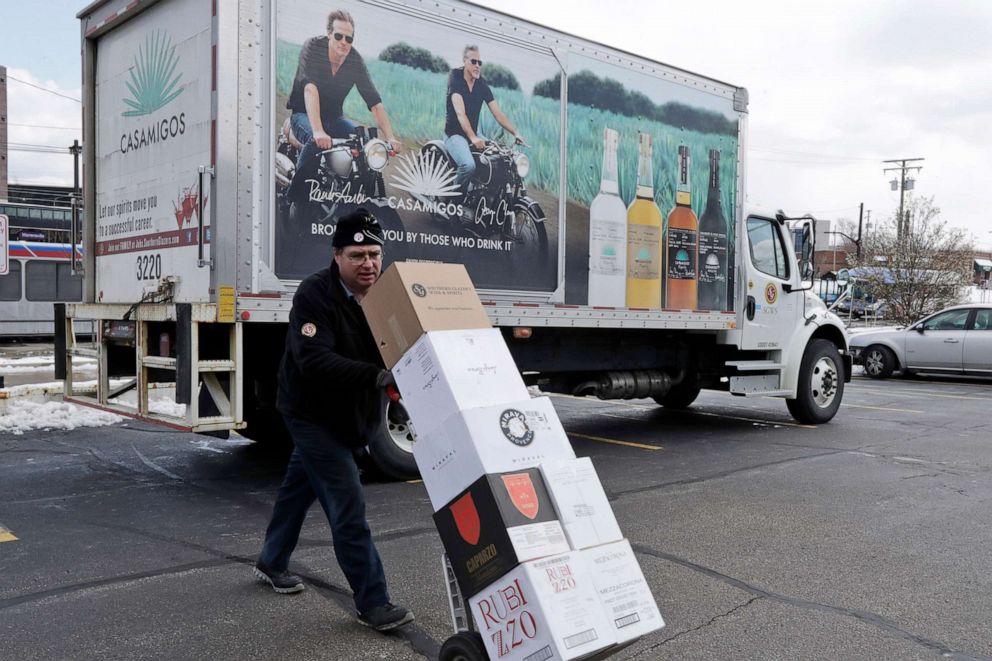 PHOTO: Chris Scobee delivers alcohol to a business during the coronavirus outbreak, April 16, 2020, in Shaker Heights, Ohio.