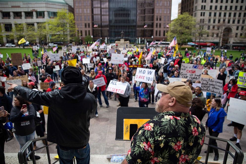 PHOTO: Demonstrators protest outside the Ohio statehouse in opposition of Governor DeWine's stay-at-home order in Columbus, Ohio, on May 1, 2020.