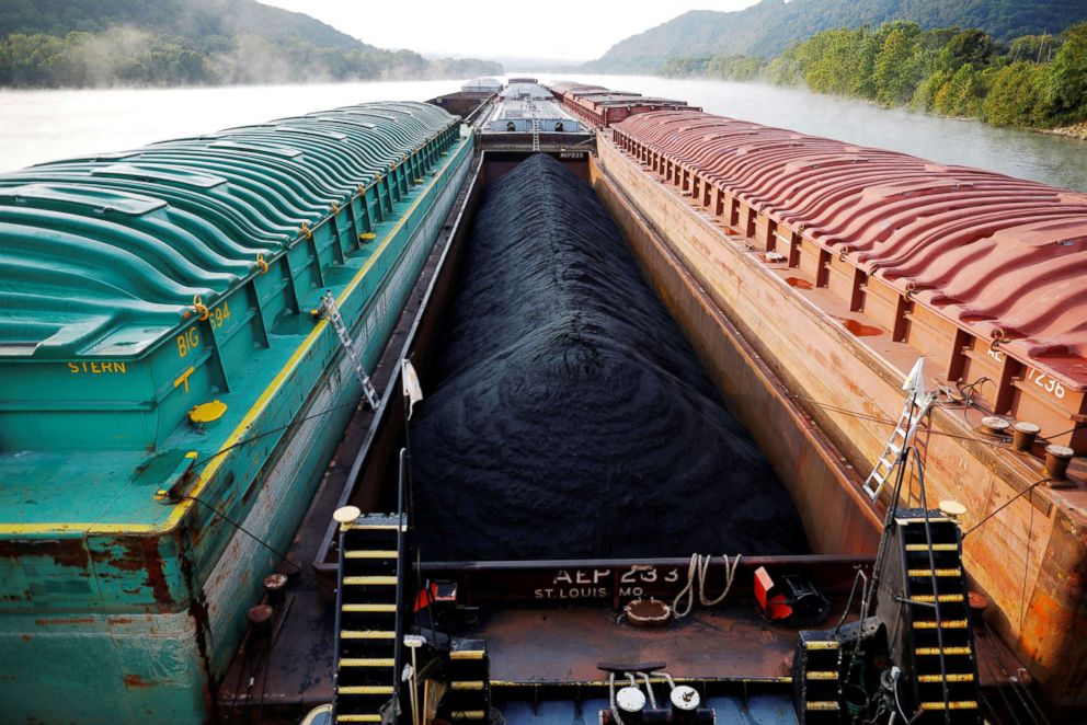 PHOTO: Barges, including one filled with coal, are pushed by Campbell Transportation Company's towboat MK McNally on the Ohio River near Stratton, Sept. 10, 2017.  