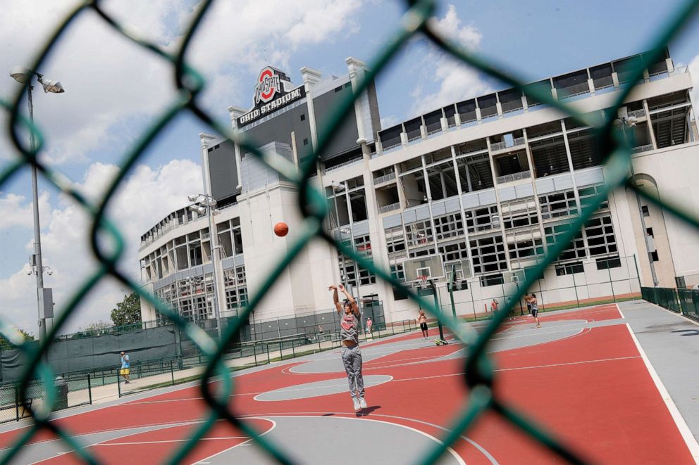 PHOTO: The Ohio State University's football stadium looms above neighboring basketball courts, May 18, 2019, in Columbus, Ohio.