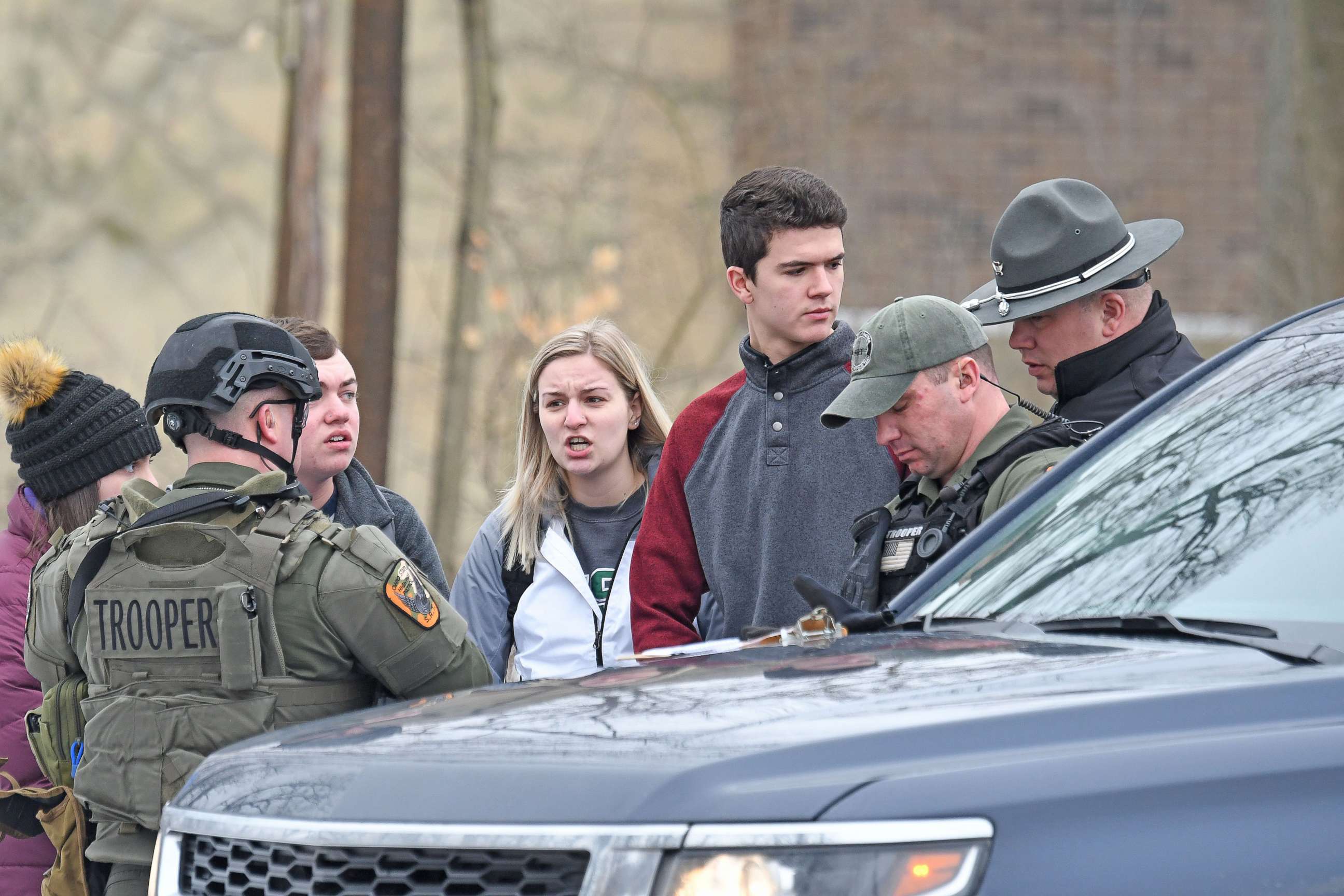 PHOTO: Students from Ohio State University Mansfield answer questions from law enforcement Monday afternoon, Feb. 11, 2019, after a student was abducted on campus.
