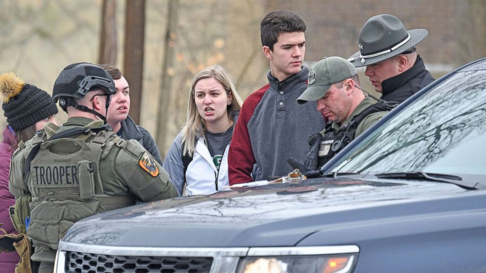 PHOTO: Students from Ohio State University Mansfield answer questions from law enforcement Monday afternoon, Feb. 11, 2019, after a student was abducted on campus.