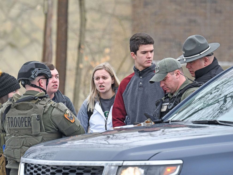 PHOTO: Students from Ohio State University Mansfield answer questions from law enforcement Monday afternoon, Feb. 11, 2019, after a student was abducted on campus.