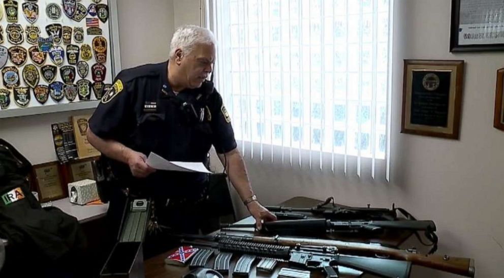 PHOTO: New Middletown, Ohio, Police Chief Vince D’Egidio shows off multiple semi-automatic rifles found at the home of James Reardon Jr., 20, who has been charged with making threats against a Jewish community center. 