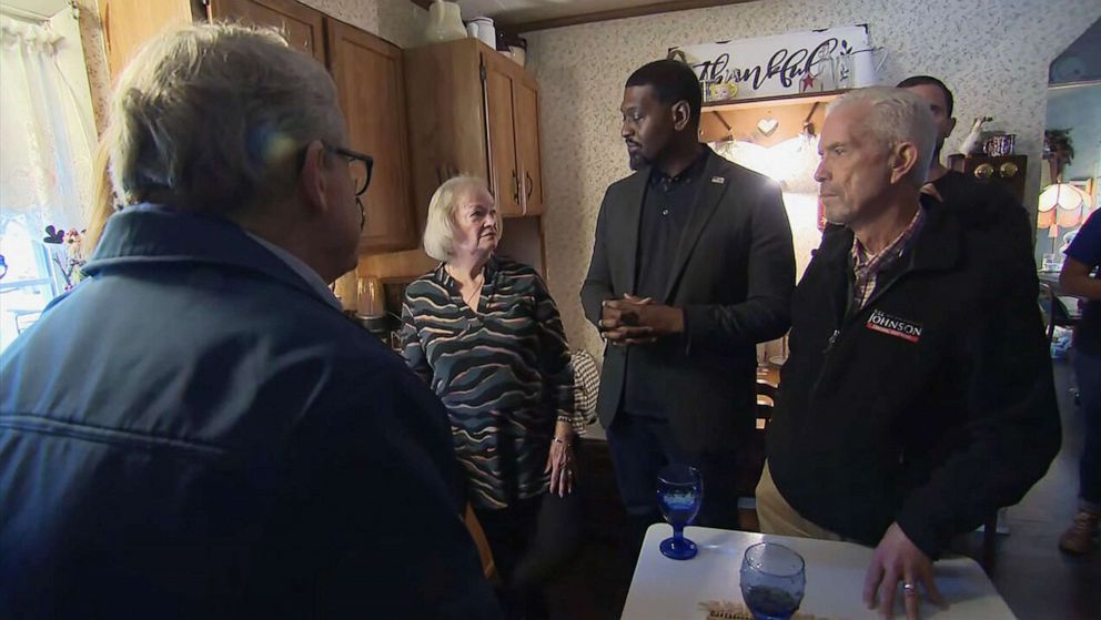 PHOTO: Ohio Gov. Mike DeWine, left, and EPA Administrator Michael Regan, second from right, talk with resident Carolyn Brown while visiting her home in East Palestine, Ohio, Feb, 21, 2023, following the Feb. 3 train derailment and chemical fire.