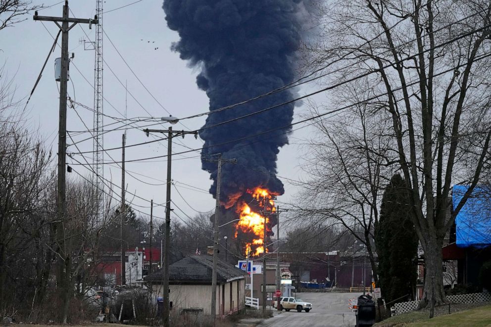 PHOTO: Flames and black smoke billow over East Palestine, Ohio, as a result of a controlled detonation of a portion of the derailed Norfolk Southern Railway train on Feb. 6, 2023.
