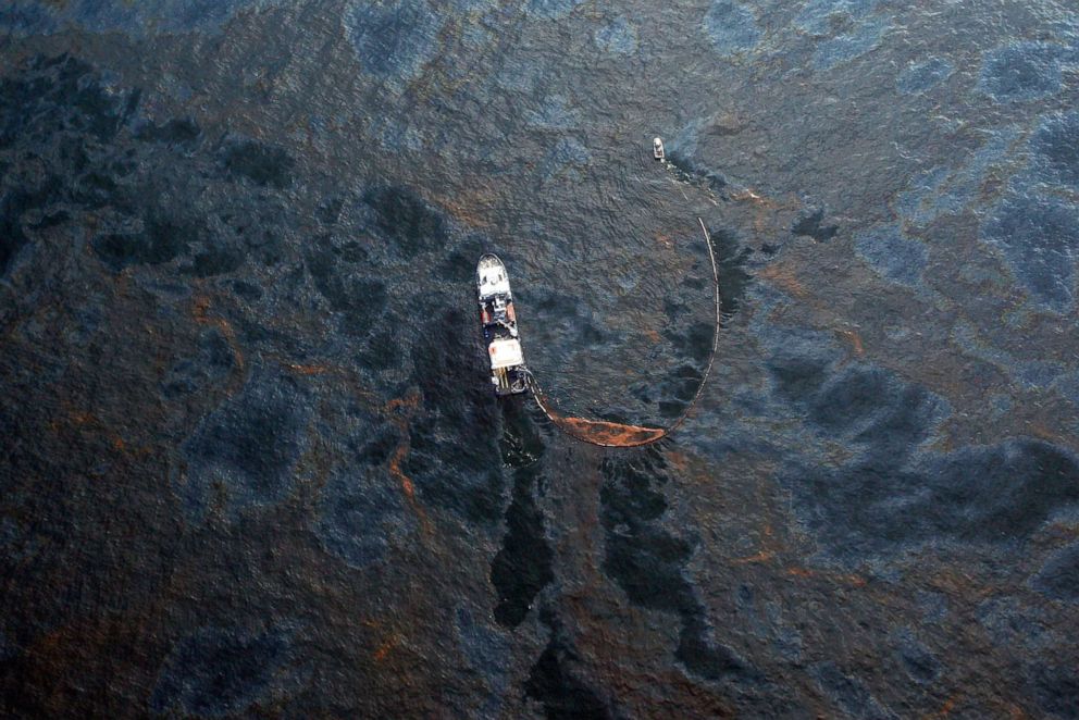 PHOTO: A boat works to collect oil that has leaked from the Deepwater Horizon wellhead in the Gulf of Mexico, April 28, 2010, near New Orleans.