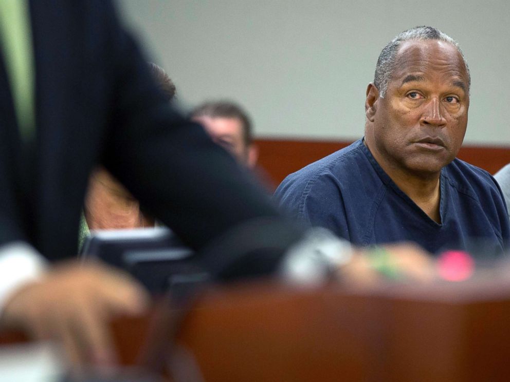 PHOTO: O.J. Simpson listens as his defense attorney, Ozzie Fumo, questions witness David Cook during an evidentiary hearing in Clark County District Court, May 16, 2013, in Las Vegas.