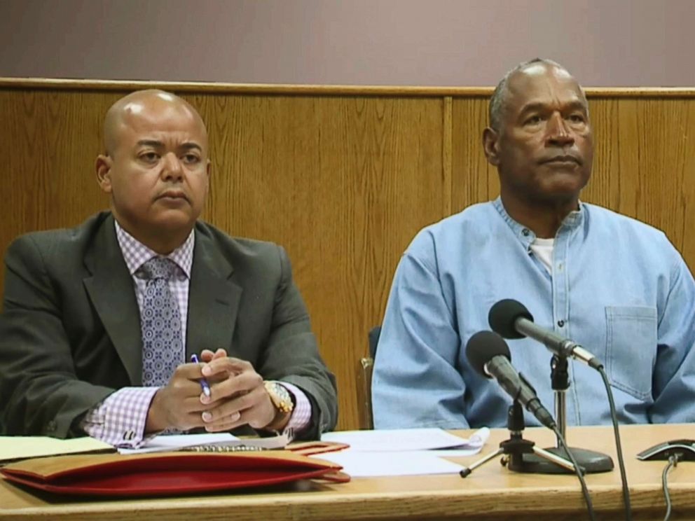 PHOTO: Former NFL football star O.J. Simpson appears with his attorney, Malcolm LaVergne, left, via video for his parole hearing at the Lovelock Correctional Center in Lovelock, Nev., on July 20, 2017.