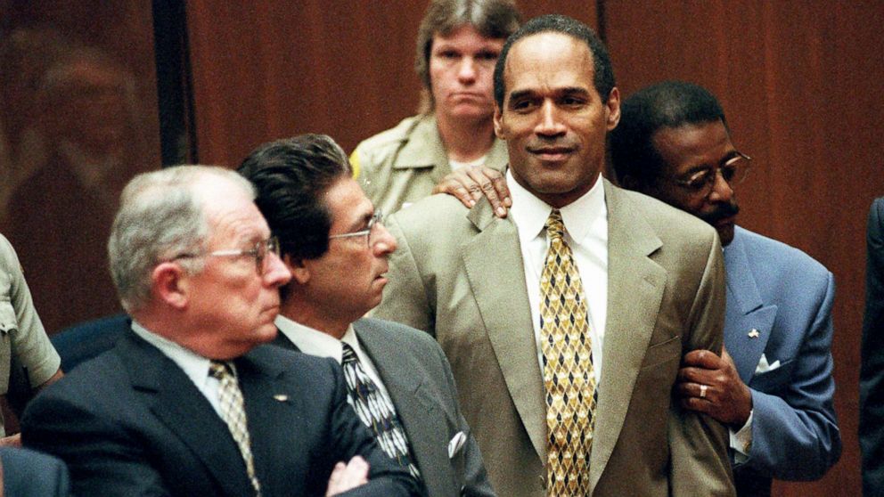 PHOTO: Attorney Johnnie Cochran Jr. holds O.J. Simpson as the not guilty verdict is read in a Los Angeles courtroom, Oct. 3, 1995.