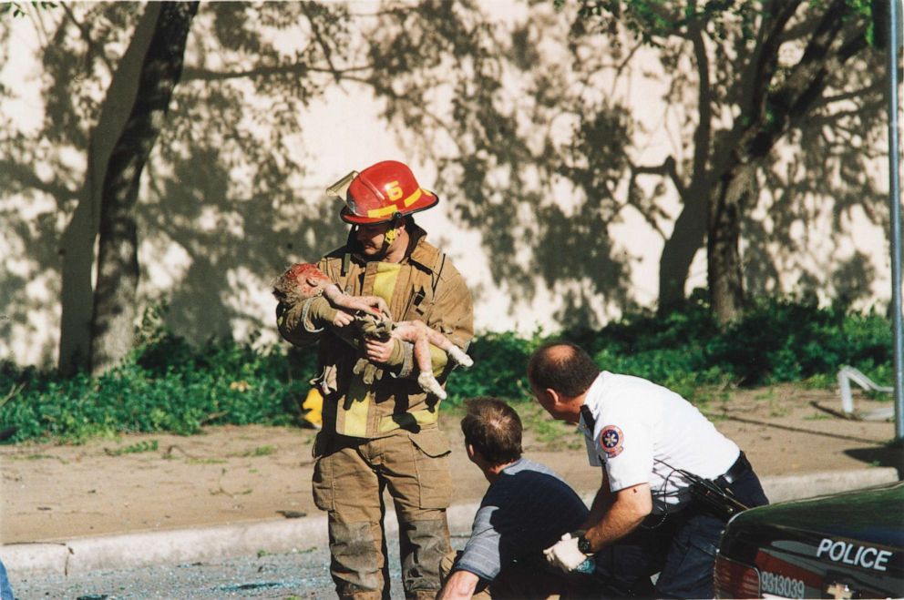 PHOTO: In an April 19, 1995 file photo, Oklahoma City firefighter Chris Fields, 30, holds a baby who was thrown from first floor of the Alfred P. Murrah Federal Building at the Stars and Stripes Daycare Center in Oklahoma City when an explosion occurred. 