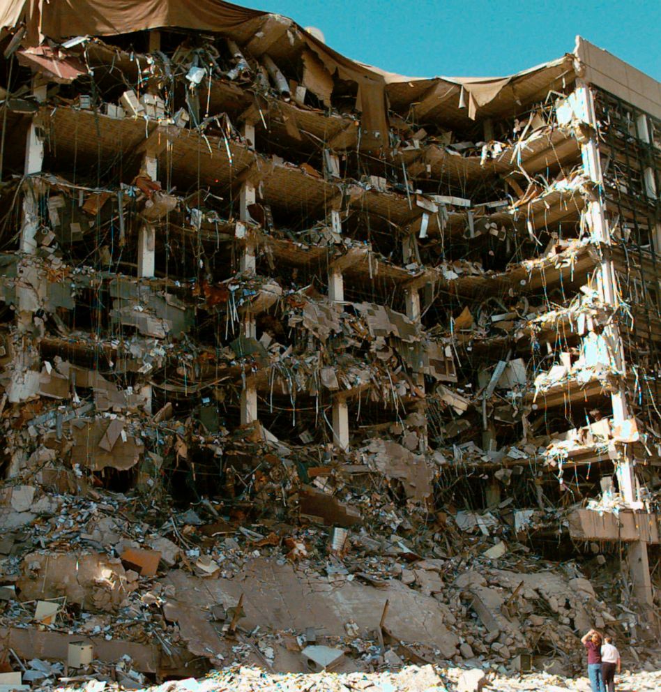 PHOTO: In this April 19, 1995, file photo, rescue workers stand in front of the Alfred P. Murrah Federal Building following an explosion in downtown Oklahoma City. One hundred sixty-eight people died as a result of the explosion. 