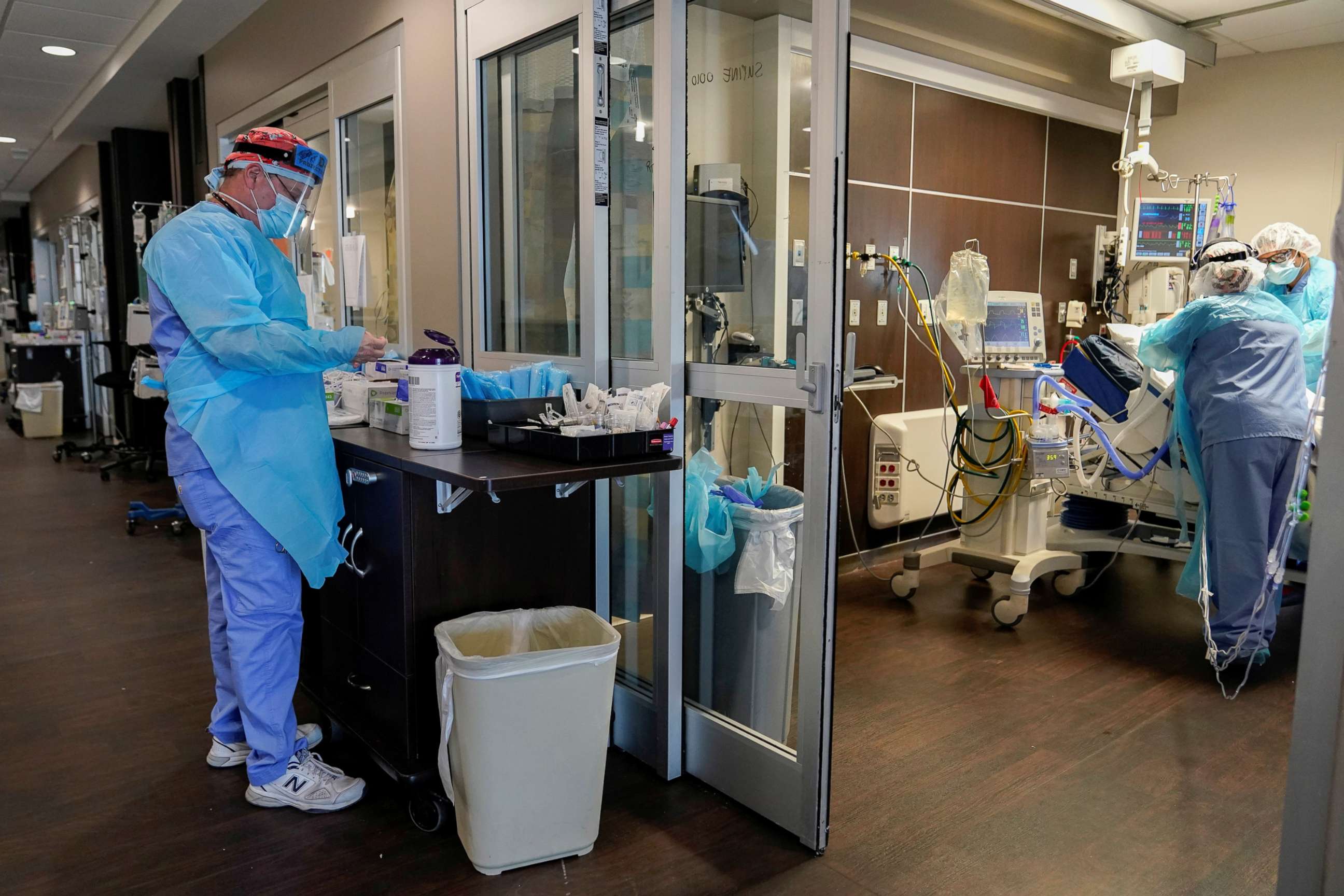 PHOTO: Nurses treat a COVID-19 patient in the ICU at SSM Health St. Anthony Hospital in Oklahoma City, Jan. 28, 2021.