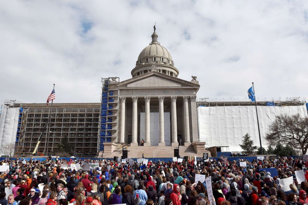 PHOTO: Teachers rally outside the state Capitol on the second day of a teacher walkout to demand higher pay and more funding for education in Oklahoma City, Okla., on April 3, 2018. 