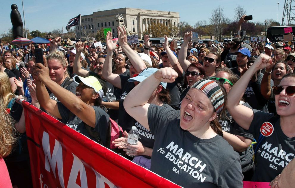 PHOTO: Madeline Jacobson, a third grade teacher in Tulsa, cries and cheers at the state Capitol after walkers from Tulsa arrives at the Capitol, as protests continue over school funding, in Oklahoma City, April 10, 2018.