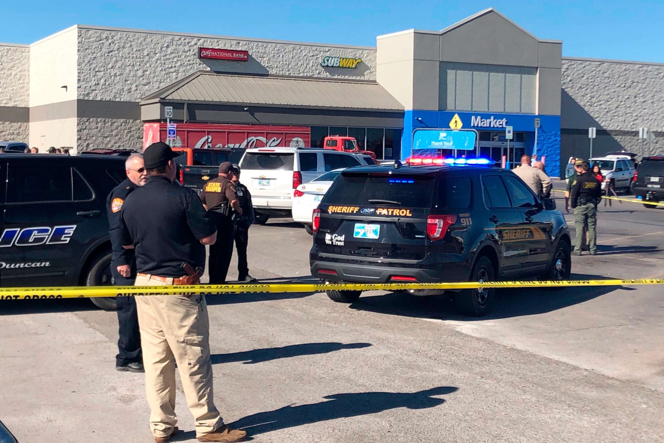 PHOTO: Law enforcement work the scene where two men and a woman were fatally shot Nov. 18, 2019, outside a Walmart store in Duncan, Okla.