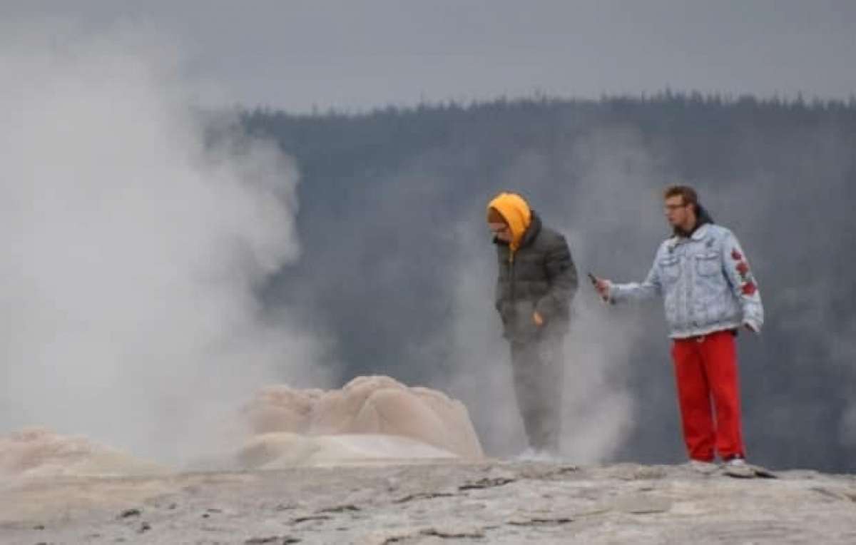 PHOTO: Two men face criminal charges for walking onto Old Faithful Geyser in Yellowstone National Park.