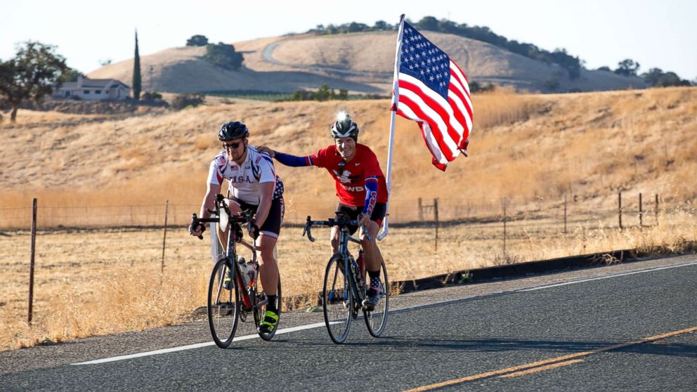 PHOTO: Participants cycle with the American flag through Summerland, Calif., Sept. 28, 2017. 