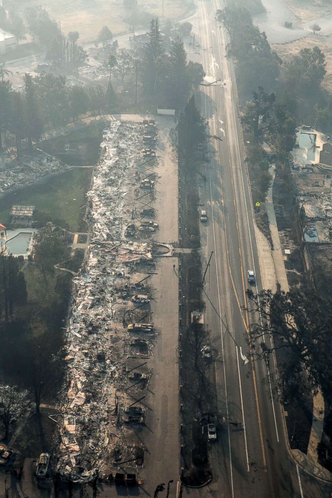 PHOTO: A firestorm that began in Napa Valley's Calistoga destroys hundreds of homes in the Mark West Estate neighborhood along Old Redwood Highway as viewed in this aerial photo taken, Oct. 11, 2017, in Santa Rosa, Calif.