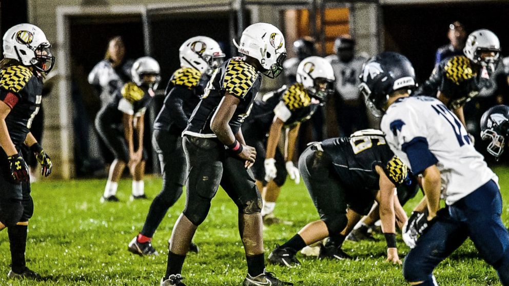 2 adults charged with assaulting minors at youth football game in ...