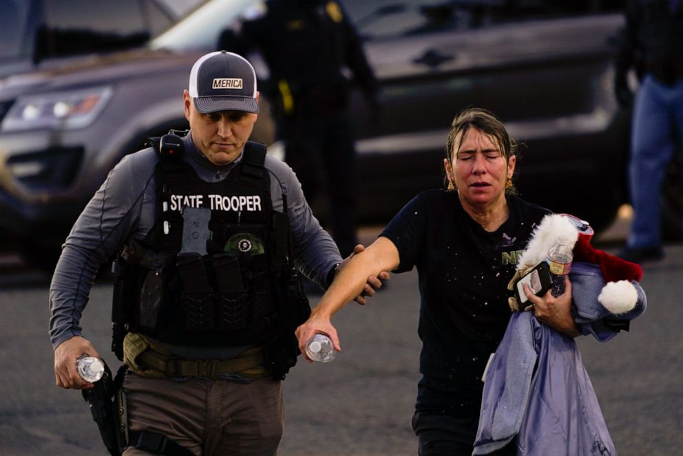 PHOTO: A Washington state trooper helps a far-right demonstrator during political clashes on Dec. 12, 2020, in Olympia, Wash.