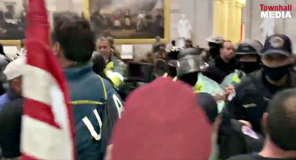 PHOTO: A man wearing what appears to be a U.S. Olympics jacket is seen among the crowd that breached security and entered the U.S. Capitol during violent protests on Jan. 6, 2021, in Washington, D.C.