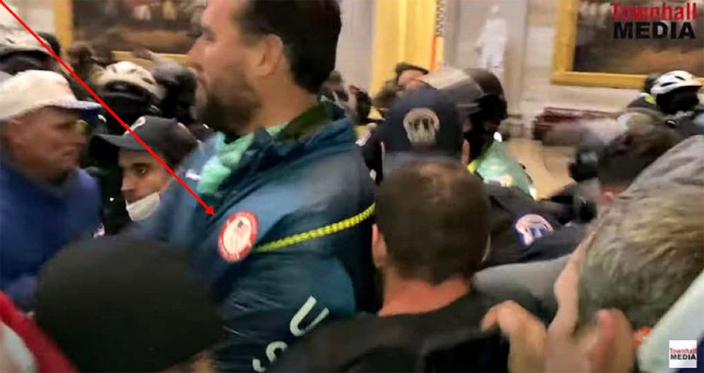 PHOTO: A man wearing what appears to be a U.S. Olympics jacket is seen among the crowd that breached security and entered the U.S. Capitol during violent protests on Jan. 6, 2021, in Washington, D.C.